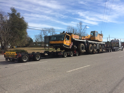 Export Logistics & Shipping, Inc. transports Liebherr LTM1250 crane by flat rack